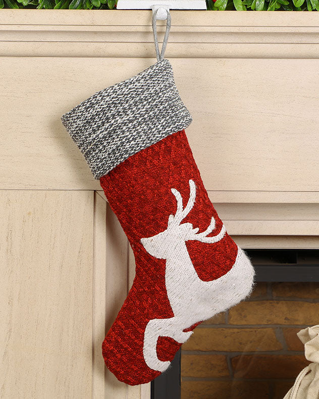 traditional christmas stocking hanging on mantle