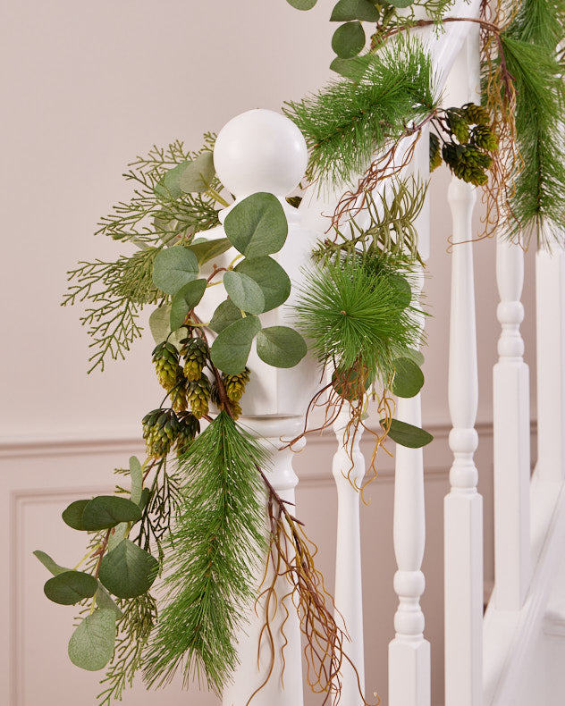 green christmas garland on banister