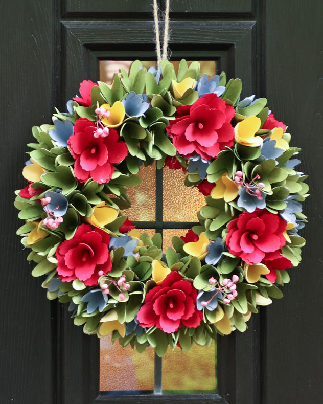 colourful wreath on black door