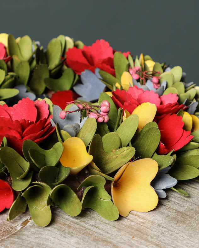 close up of colourful wreath on table