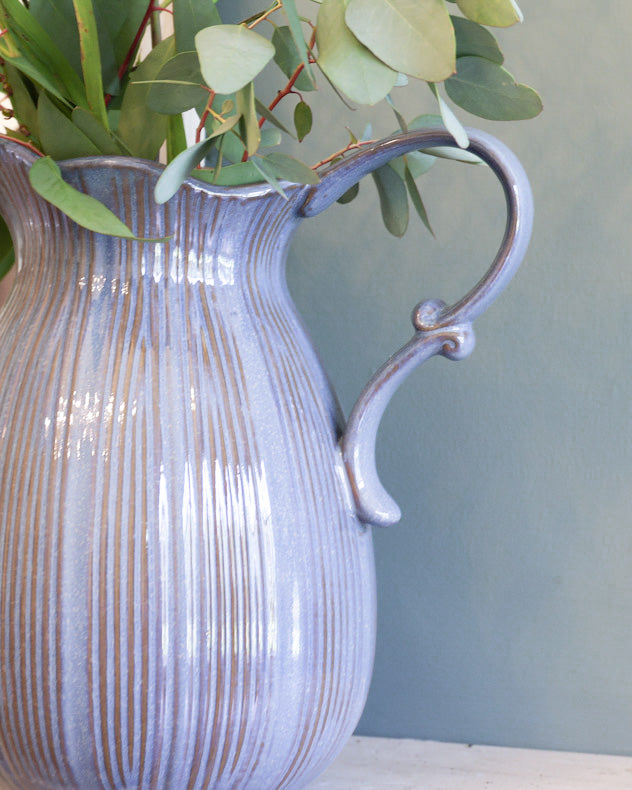 blue ceramic pitcher vase