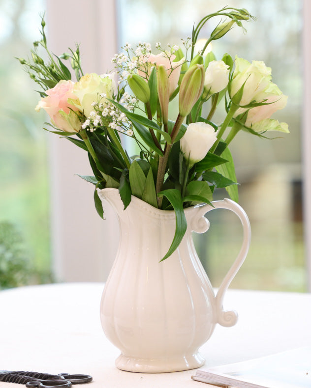 white fluted vase