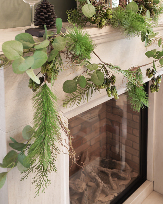 evergreen christmas garland on mantle