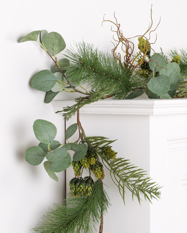 green christmas garland on mantle