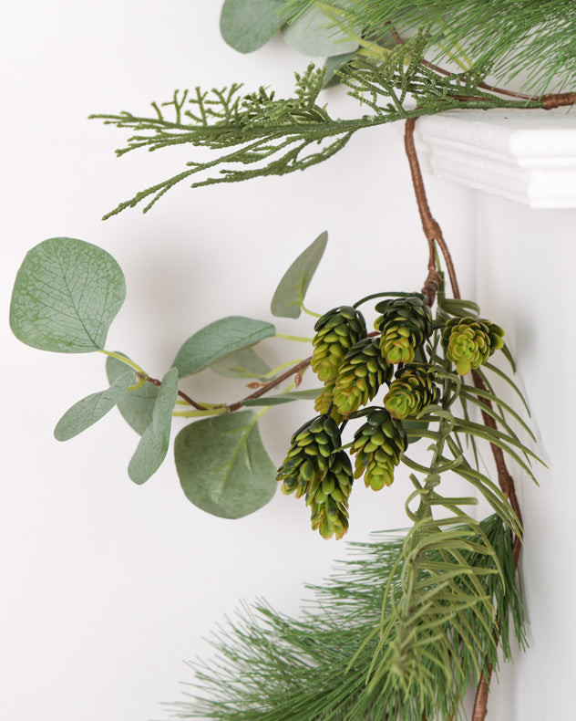 green christmas garland on mantle