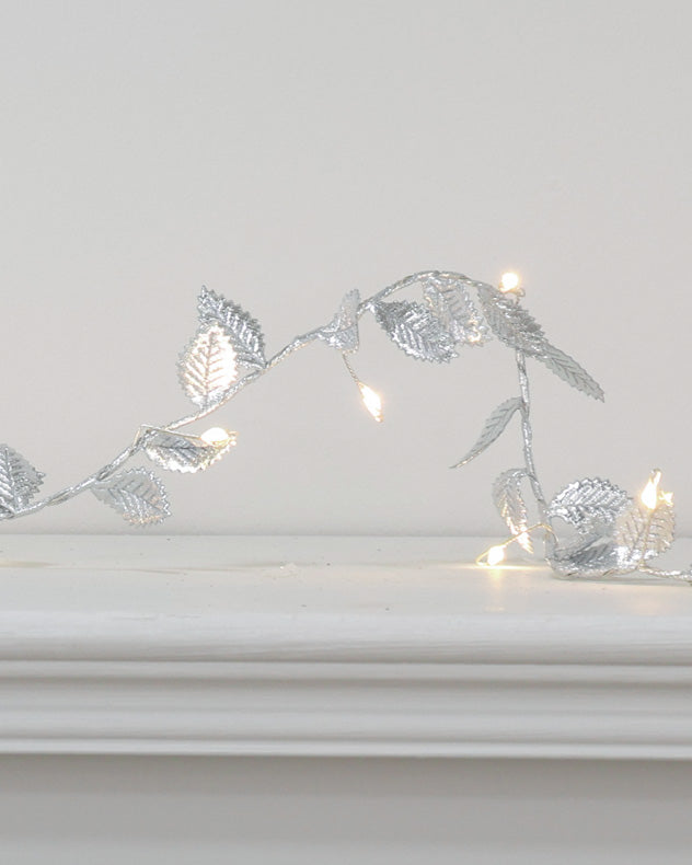 silver christmas garland on mantle