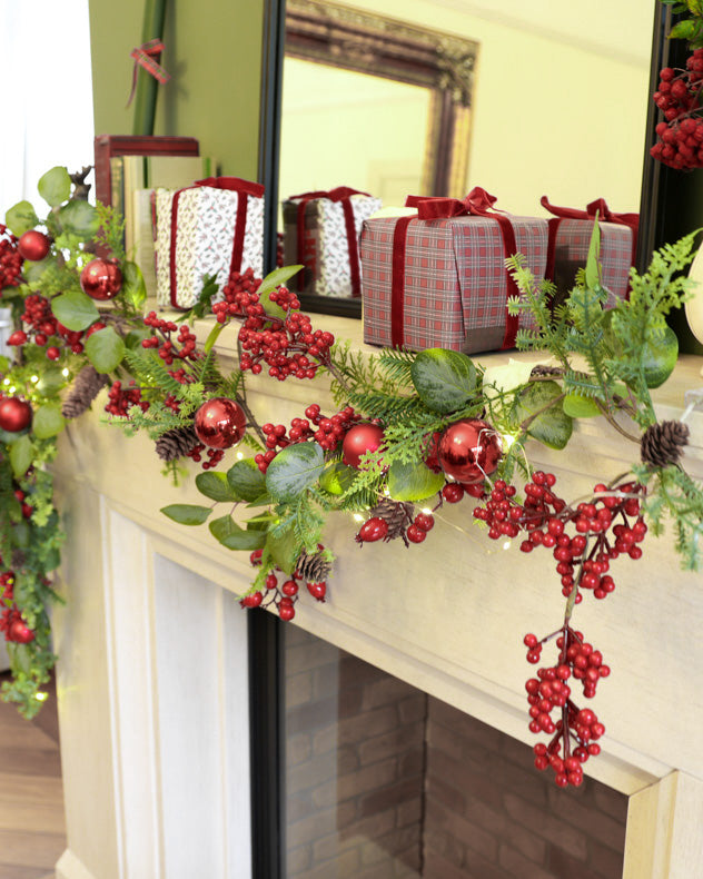 red green christmas garland on mantle