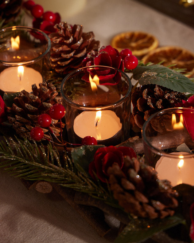 red berry and pinecone christmas candle centrepiece