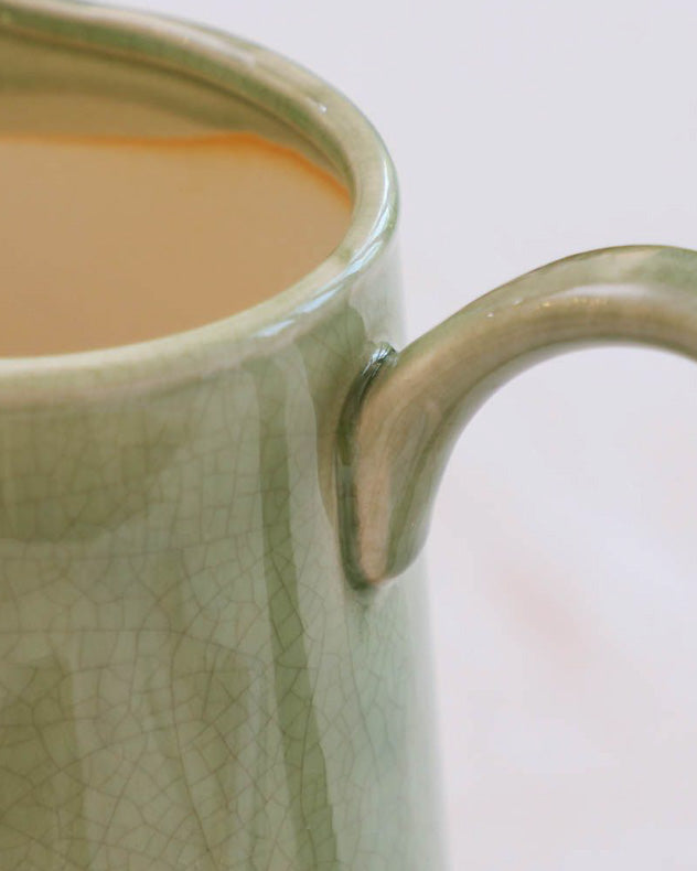 green ceramic flower jug