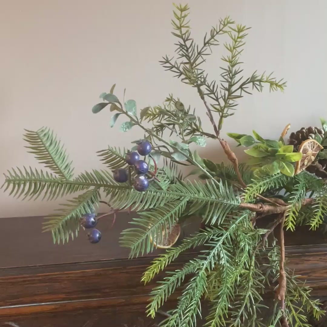 christmas garland winter fruits and pinecone
