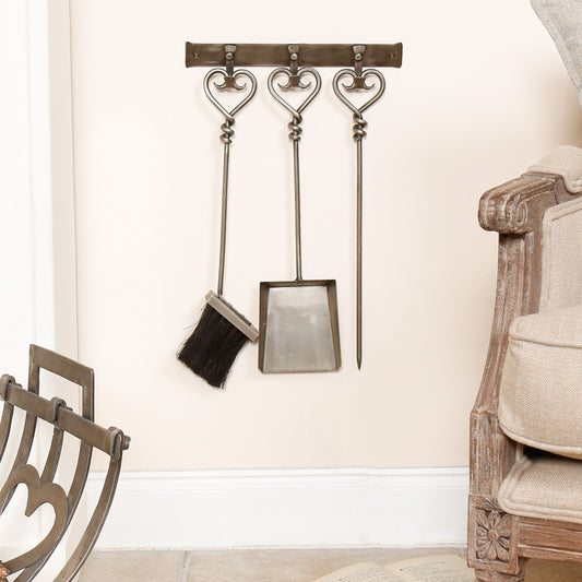 silver wall mounted fireside tools